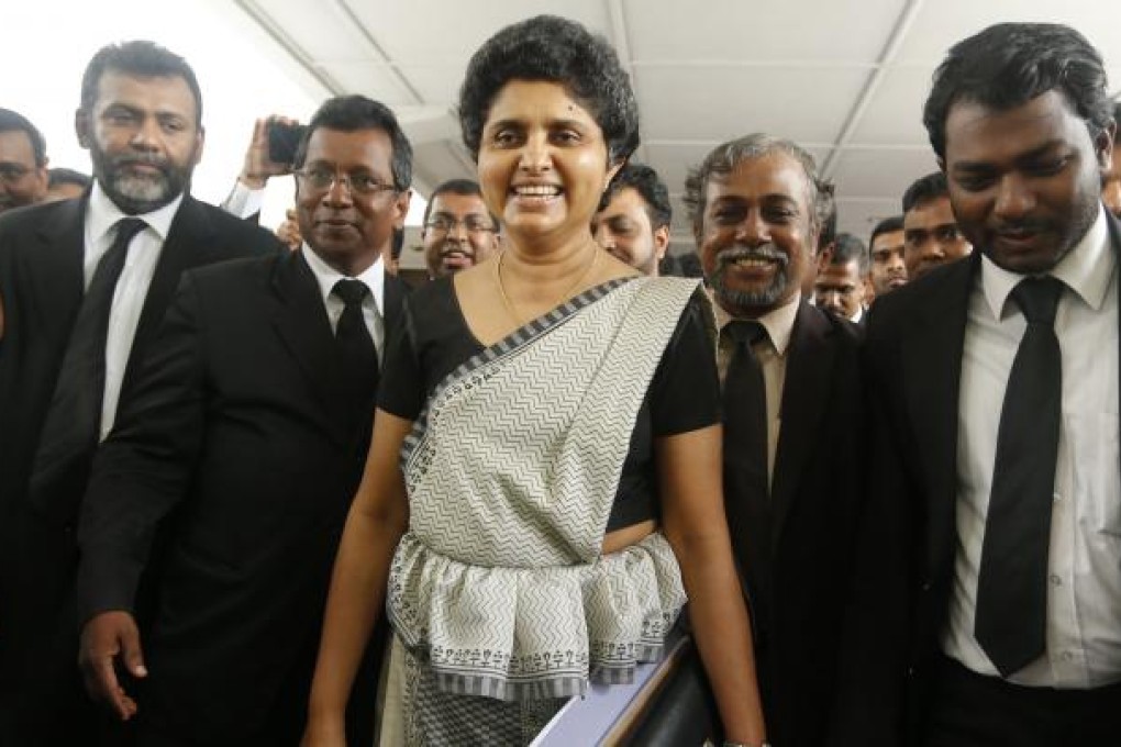 Sri Lanka’s former chief justice Shirani Bandaranayake, centre, leaves the Supreme Court complex to face impeachment proceedings in Colombo last year. Photo: AP