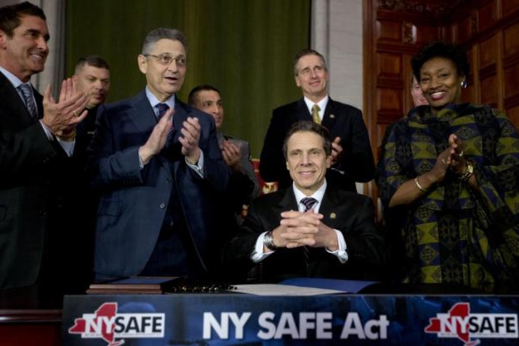 Governor Andrew Cuomo and legislative leaders celebrate. Photo: AP