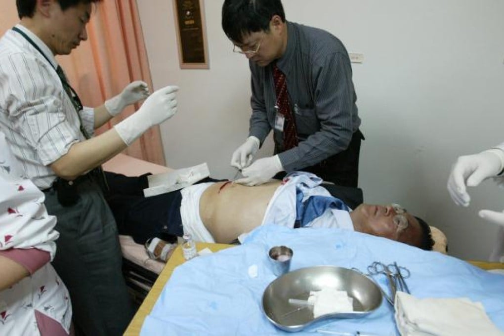 Chen Shui-bian is treated for his bullet wound in 2004. Photo: Reuters