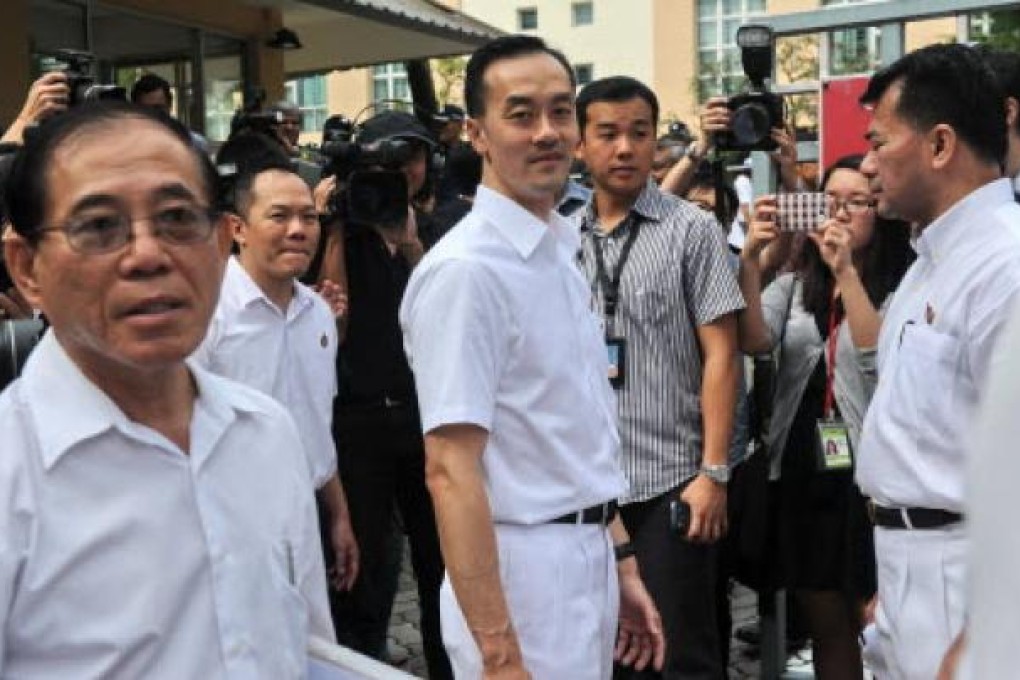 People's Action Party's (PAP) candidate Koh Poh Koon (centre) arrives at a nomination centre in Singapore. Singapore's ruling party is trying to reverse a big drop in popularity. Photo: AFP