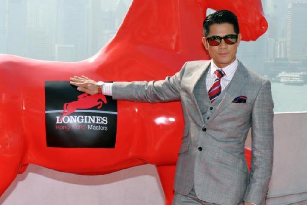 Aaron Kwok poses with a prancing steed. Photo: SCMP