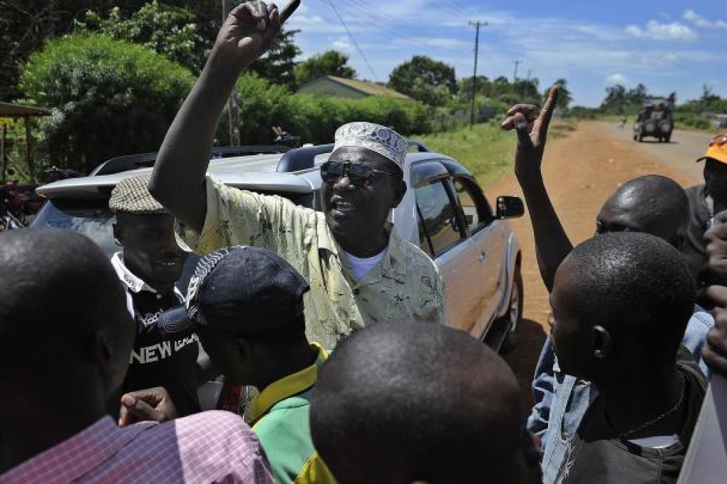 President Barack Obama’s Kenyan half brother, Malik Obama (centre) rallies supporters near Nyang’oma in Kogelo, now renowned as the Obamas' traditional home. Photo: AFP