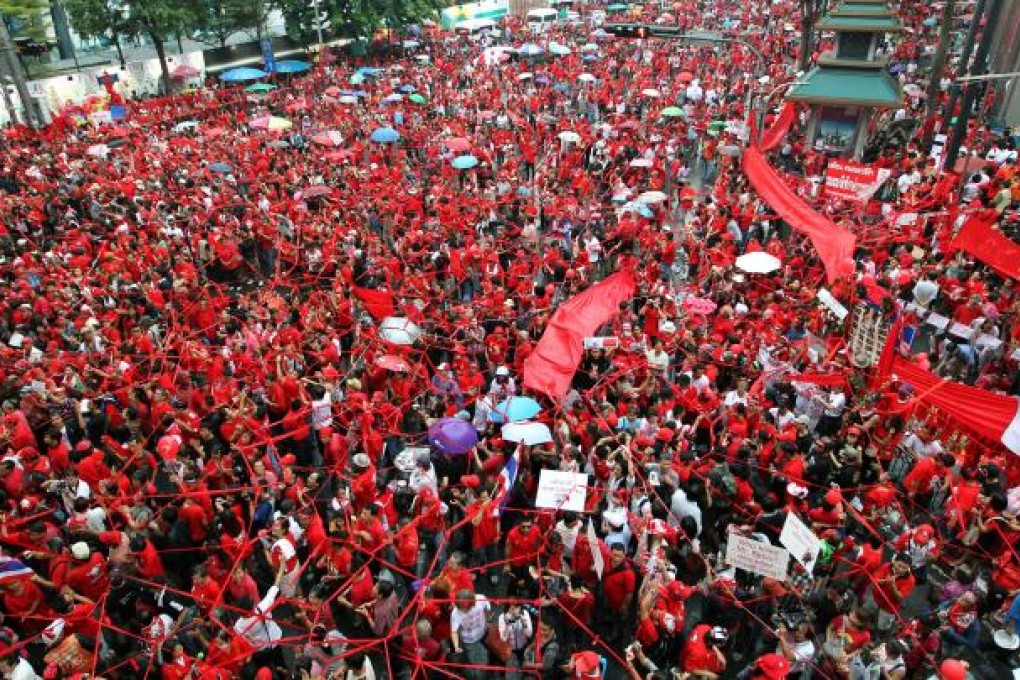 Anti-government red-shirt protesters gather in the streets in September 2010. Photo: EPA
