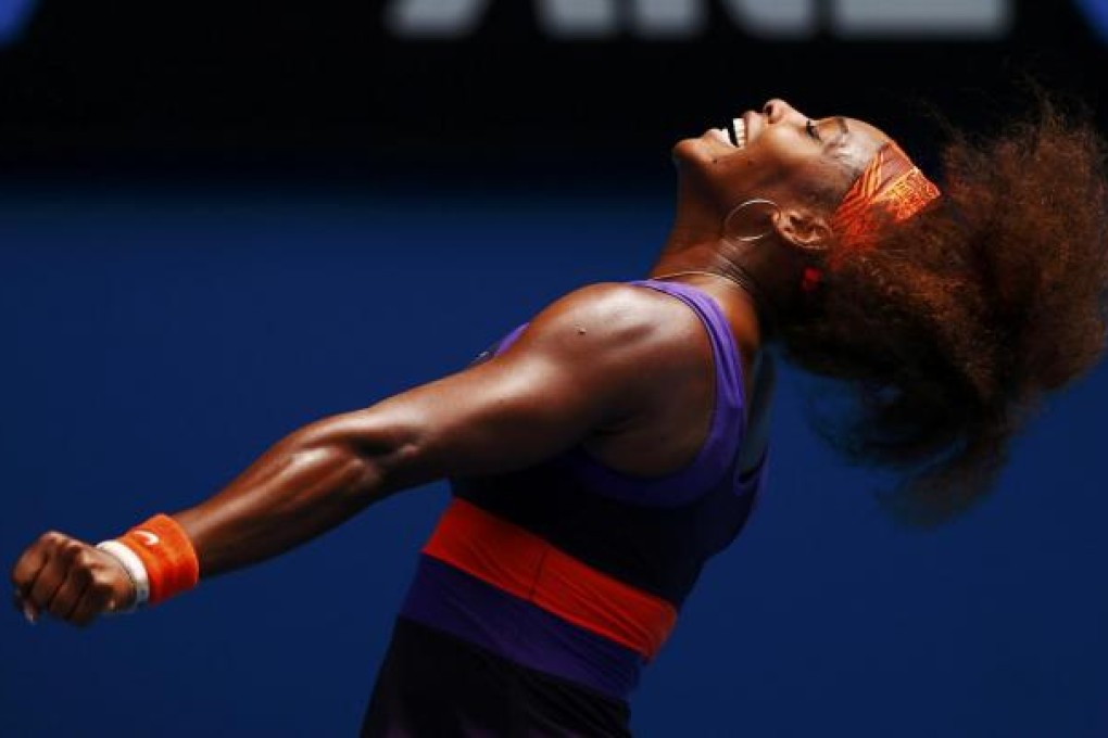 Serena Williams celebrates defeating Garbine Muguruza of Spain during their singles match at the Australian Open. The 15-time grand slam winner suffered a bust lip during the match. Photo: Reuters