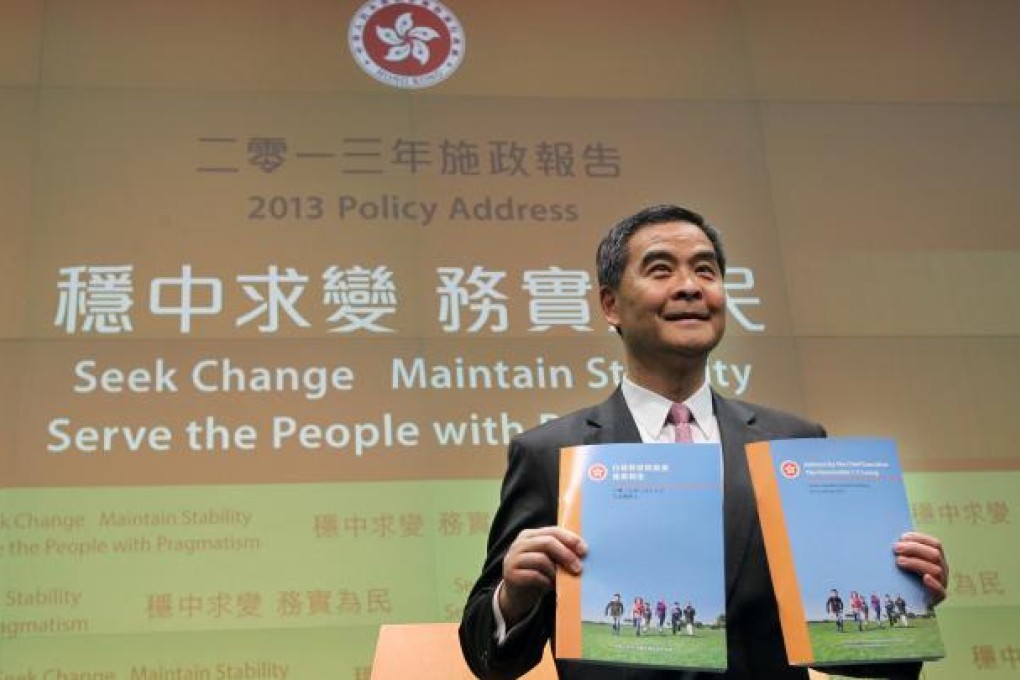 Chief Executive Leung Chun-ying with copies of his policy address. Photo: KY Cheng