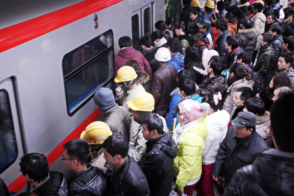 Beijing commuters head home in the evening rush hour.