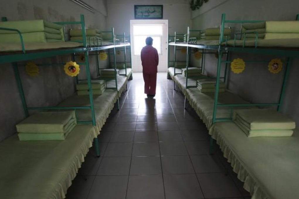 A woman in her dormitory at a re-education through labour centre in Jiangsu province. Photo: Imaginechina