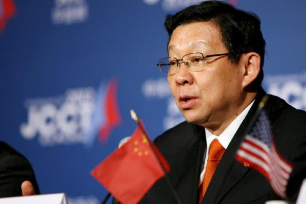 Chinese Minister of Commerce Chen Deming reassures the business community that the government will improve the investment environment. Photo: Xinhua