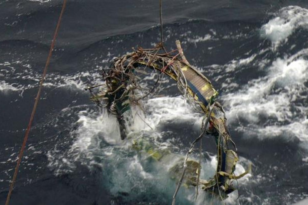 A South Korean Navy vessel recovers debris from North Korea’s rocket launch in December 2012. The South is now increasing its missile strength. Photo: AFP/Defence Ministry