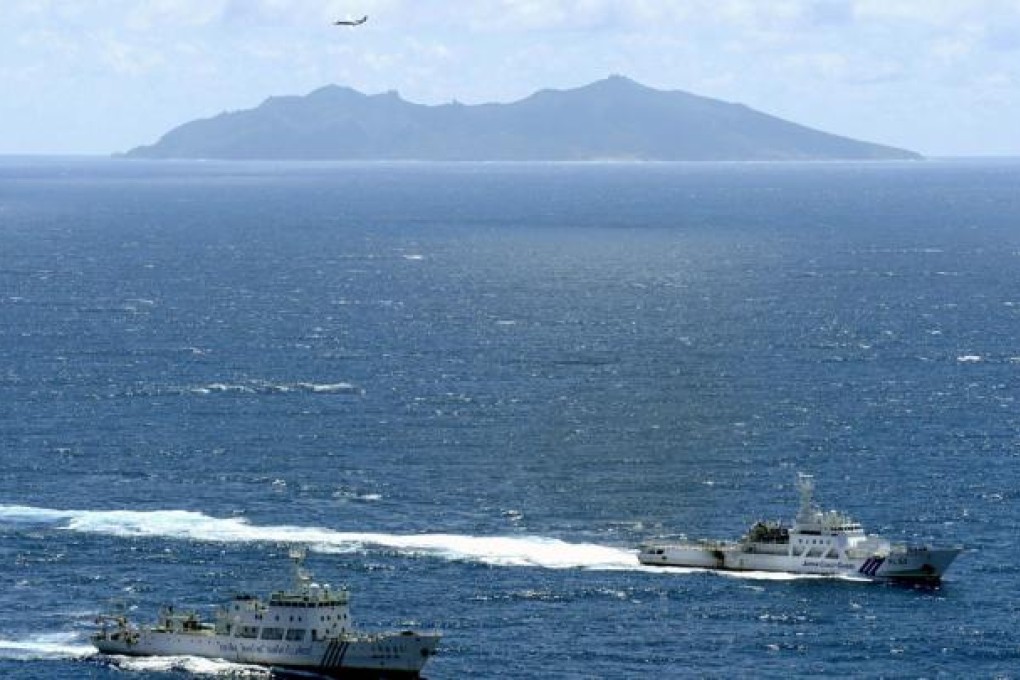 The Chinese marine surveillance ship Haijian No. 51 cruising as the Japan Coast Guard ship Ishigaki sails near the disputed islands, called Senkaku in Japan and Diaoyu in China, in the East China Sea. Photo: Reuters