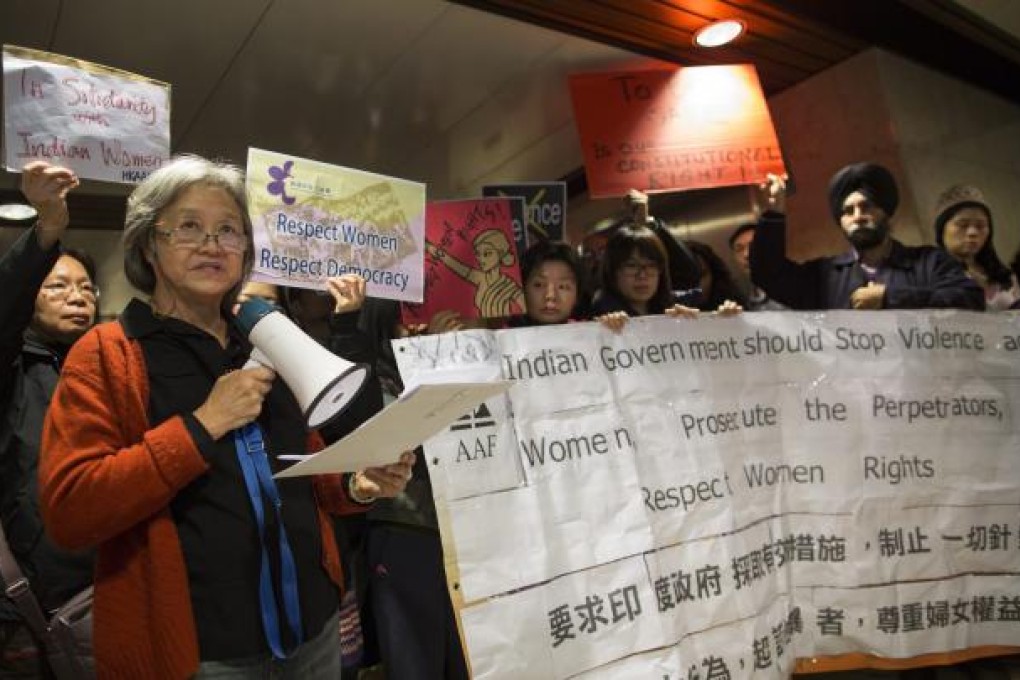 Protesters against violence towards women outside the office of the India consulate in Hong Kong. Photo: EPA
