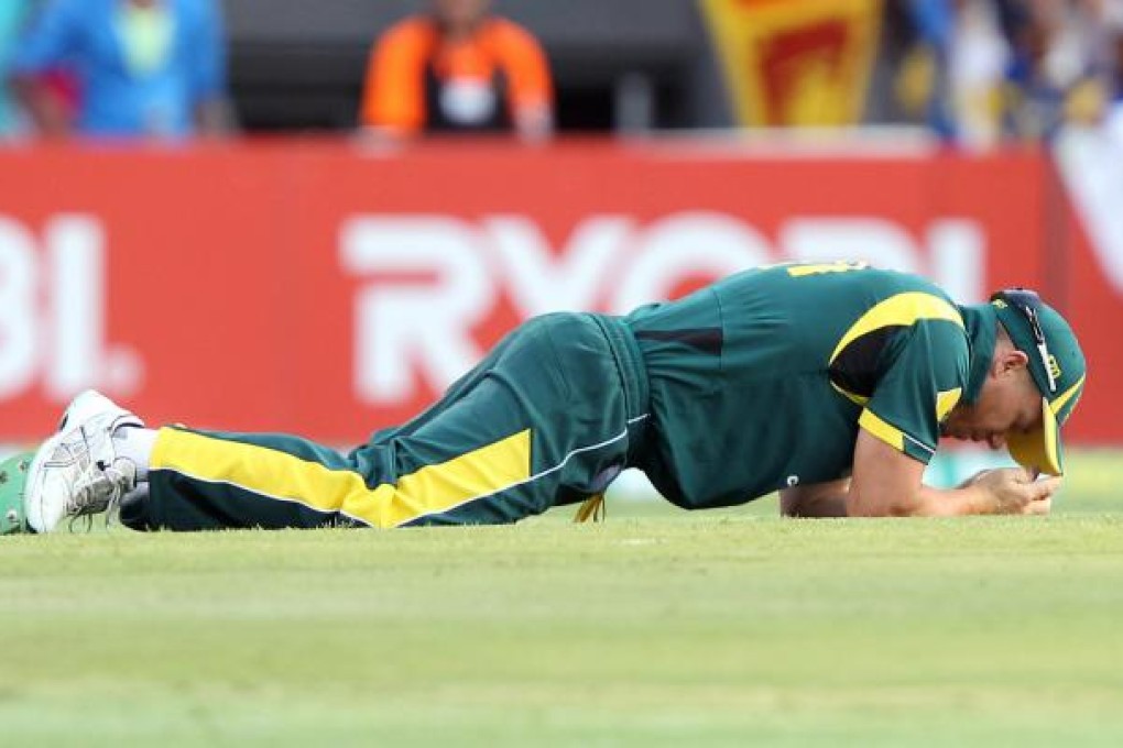 David Warner reflects after dropping a catch in Brisbane. Photo: AP