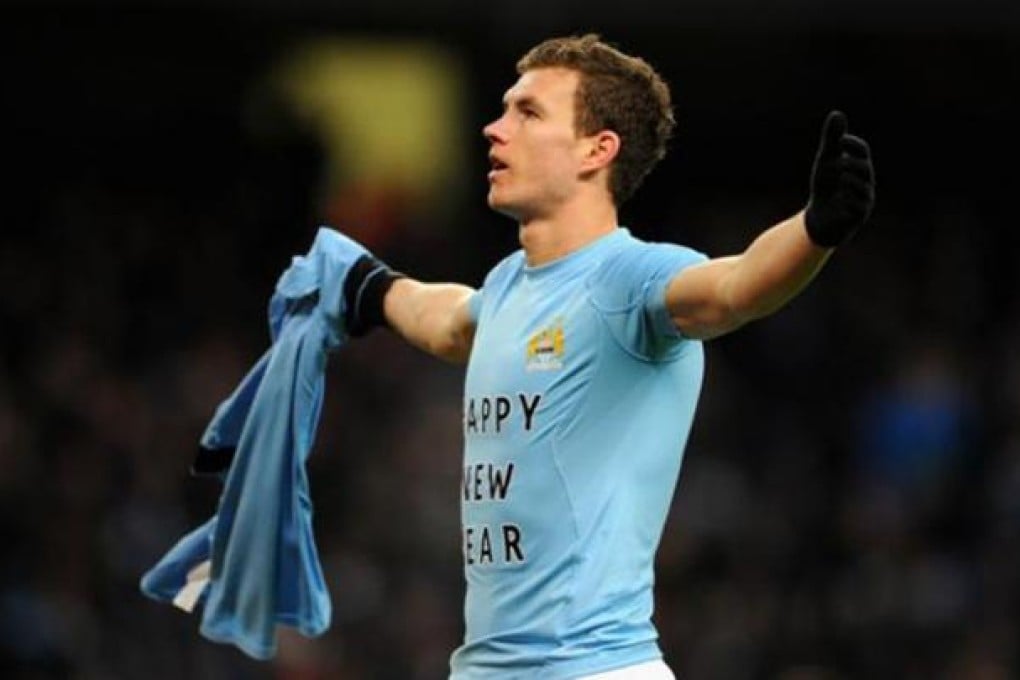 Manchester City's Eden Dzeko removed his shirt after scoring against Stoke on New Year's Day to reveal "Happy New Year" printed on his undershirt.
