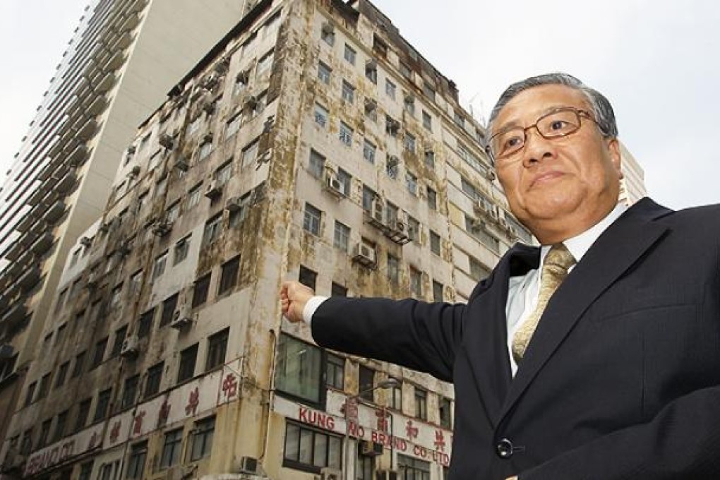 The URA's Joseph Lee, Director, Acquisition & Clearance - Industrial Buildings points to Wing Hong Factory Building, Yu Chau West Street in Cheung Sha Wan. Photo: Edward Wong