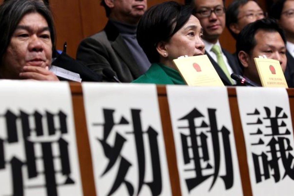 Lawmakers Leung Kwok-hung, Emily Lau Wai-hing and other Pan-democratic lawmakers put forward a motion to impeach Chief Executive Leung Chun-ying. Photo: SCMP Pictures