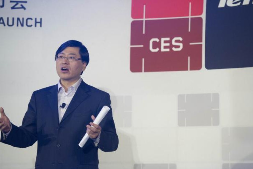 Yang Yuanqing, chairman and CEO of the Lenovo Group, introduces the company's latest products during the 2013 International Consumer Electronics Show (CES) in Las Vegas on January 8, 2013. Photo: Xinhua