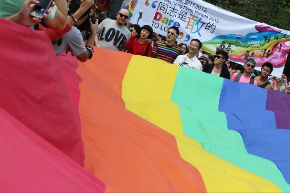 Lawmaker Raymond Chan, flanked by singer-songwriter Anthony Wong and singer Denise Ho, lead Hong Kong Pride Parade. Photo: Nora Tam