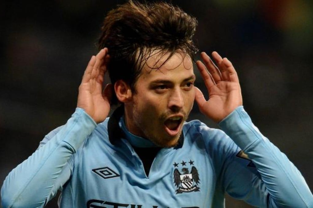 David Silva celebrates scoring his second goal. Photo: AFP