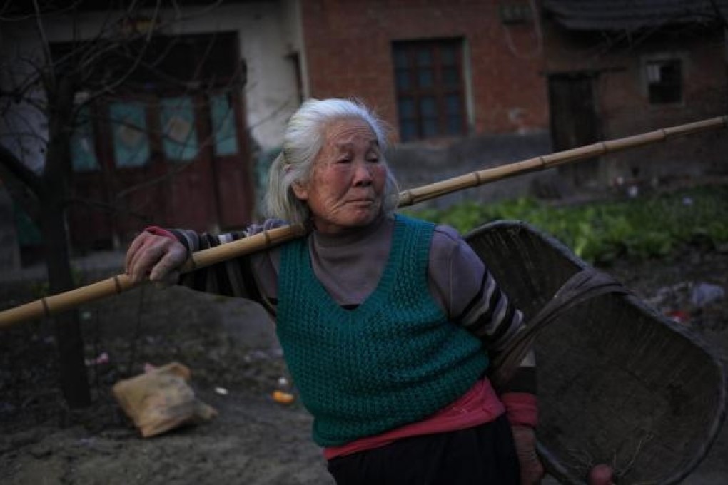 A Chinese villager walks home with an empty basket. Photo: EPA