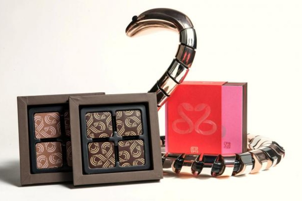 Vero's gift set includes one box of chocolates for Lunar New Year and another for Valentine's Day. The snake design is by Dennis Chan.