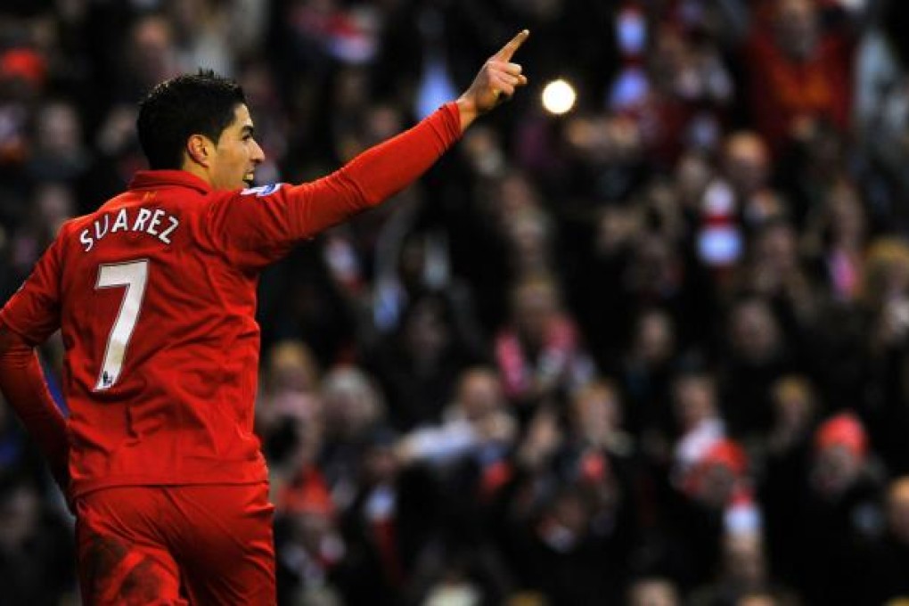 Liverpool's Luis Suarez celebrates after scoring against Norwich City at the Anfield stadium on Saturday. Photo: AFP