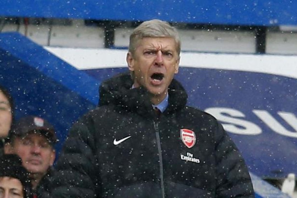 An angry Arsene Wenger in the dugout at Chelsea. Photo: Reuters