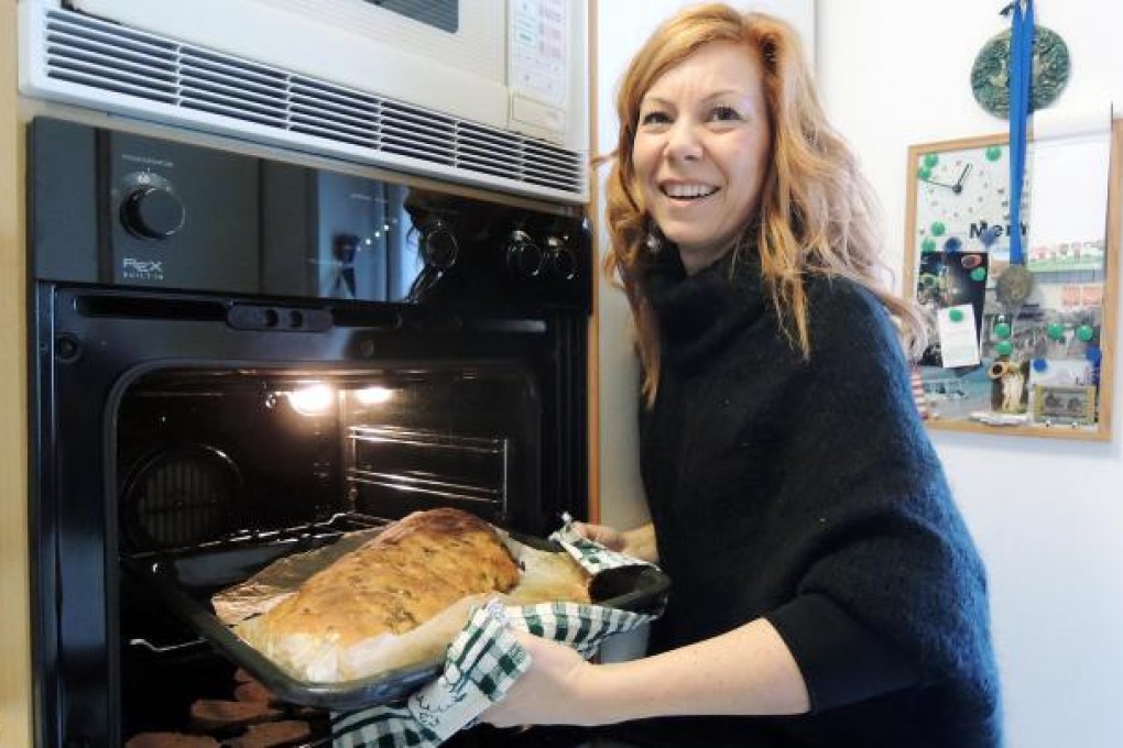 Simona Ferrante bakes a focaccia roll.