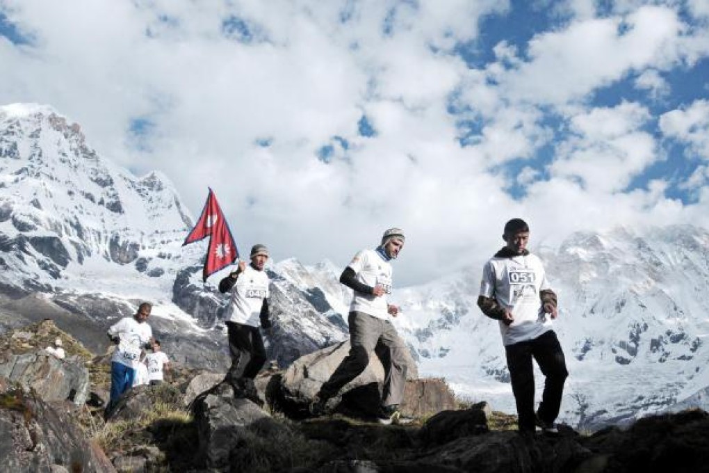 Foreigners and locals alike take on the Annapurna Marathon. Photo: AFP