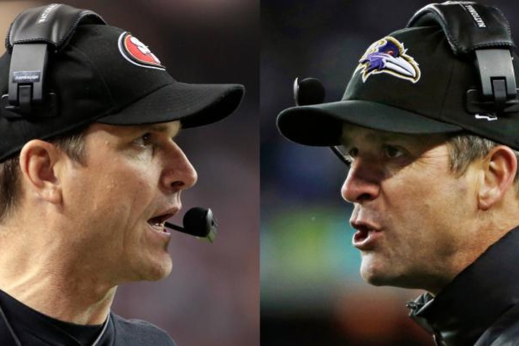 Jim Harbaugh, left, and elder brother John Harbaugh. Photo: AP