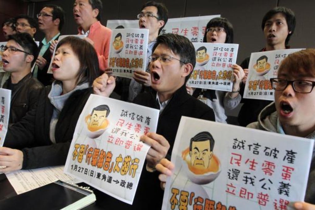 Members of the pan-democratic camp gather to protest about Chief Executive Leung Chun-ying's policy address. Photo: Sam Tsang