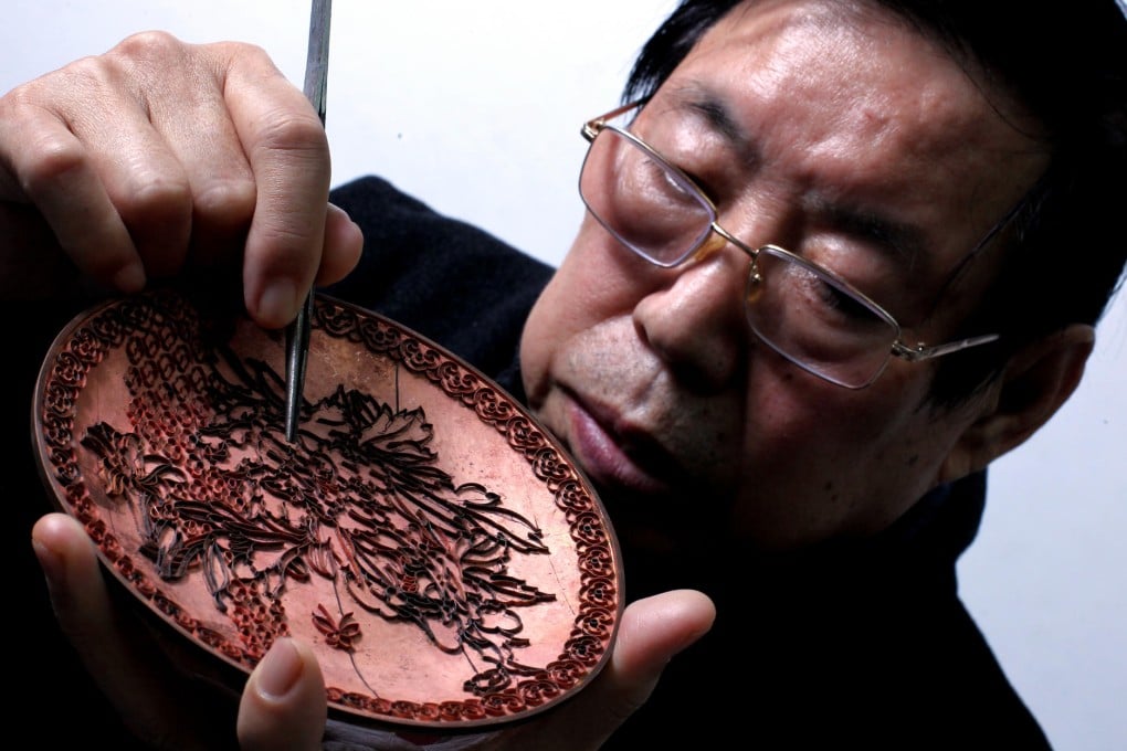 Zhang Tonglu says many youngsters do not want to learn cloisonne because it is too hard. Photo: Nora Tam