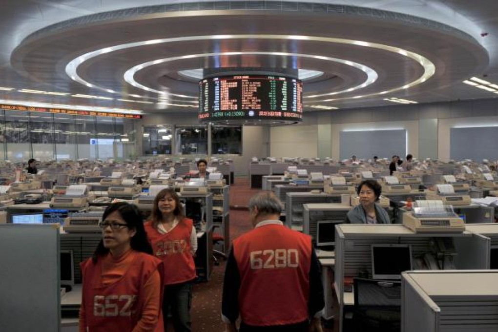 Hong Kong investors had a subdued reaction to the central bank's ambitious plan. Photo: AFP