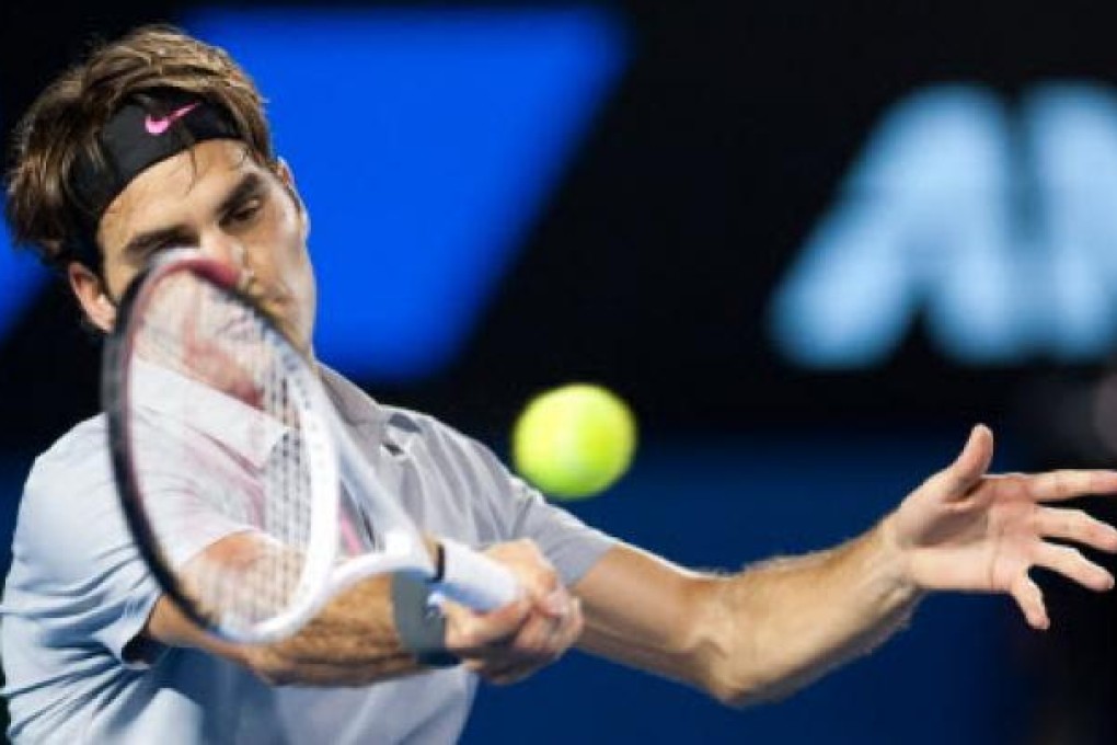 Roger Federer of Switzerland up against Milos Raonic of Canada at 2013 Australian Open tennis tournament in Melbourne. Photo: Xinhua