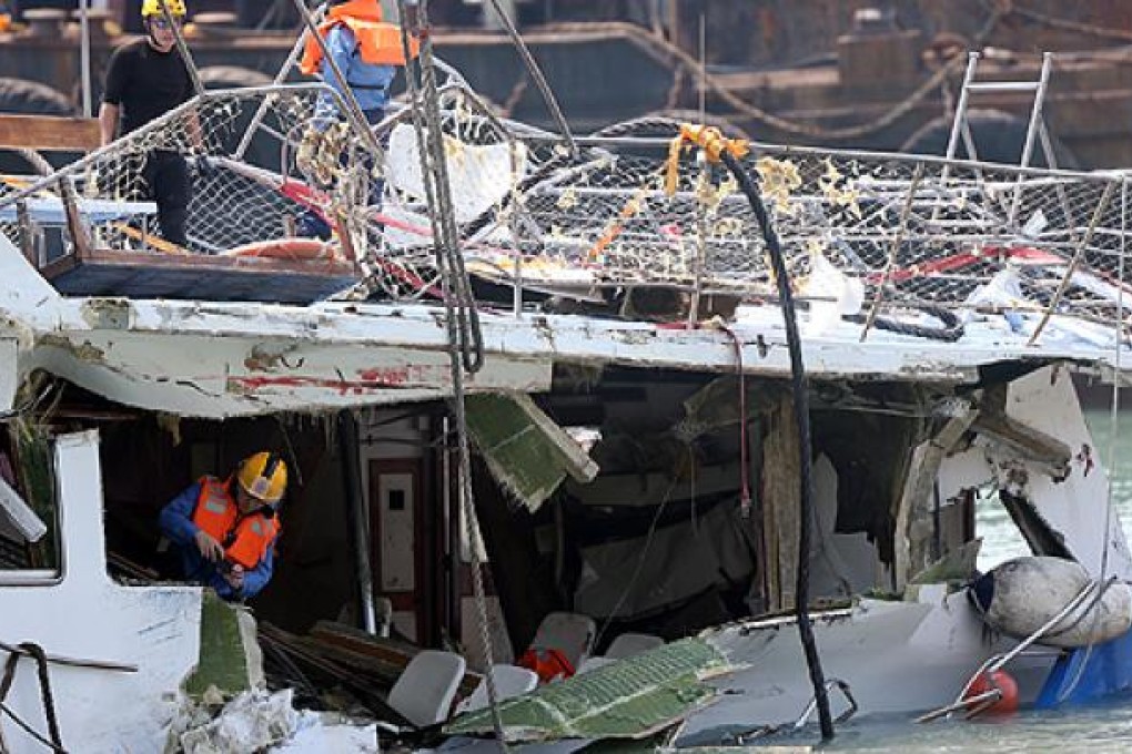 Fireman inspect the damaged Lamma IV ferry soon after the October 1 collision. Photo: David Wong