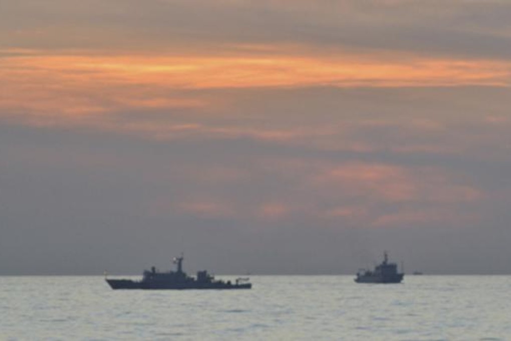 Chinese patrol ships which sailed between a Philippines warship and Chinese fishing boats near the Scarborough Shoal in April. Photo: Reuters