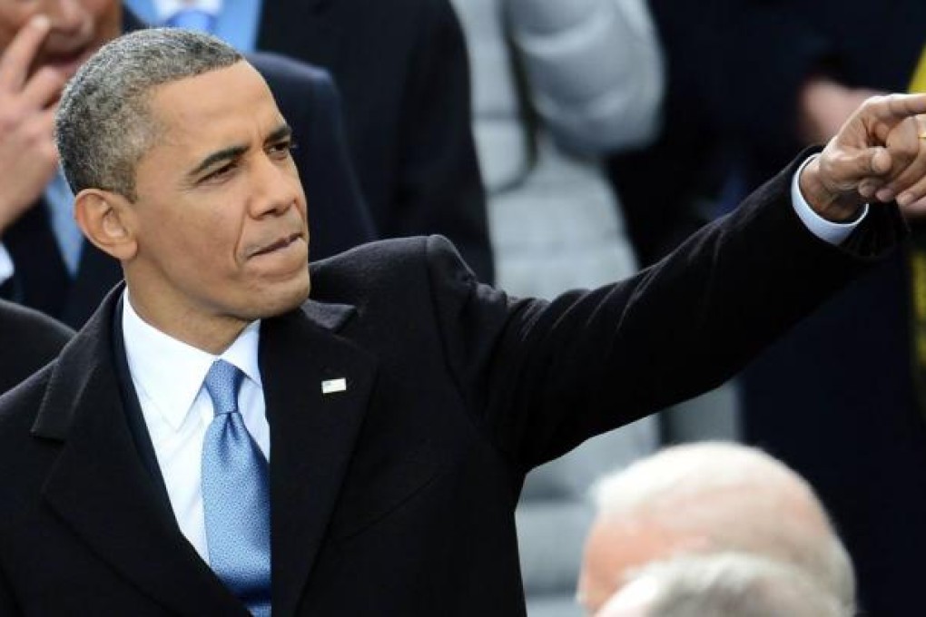 US President Barack Obama gestures at his public swearing-in ceremony at the US Capitol in Washington DC yesterday, kicking off a second term that will see him go on the offensive. Photo: AFP