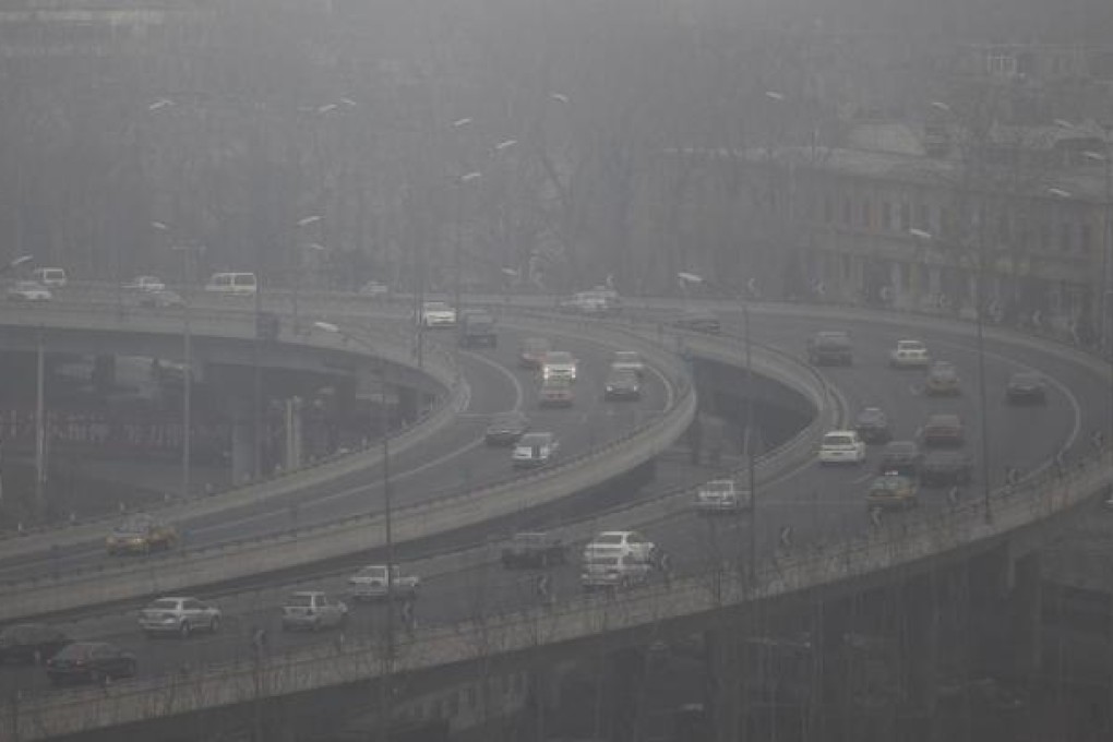 Thick smog above an elevated highway in Beijing. Photo: EPA
