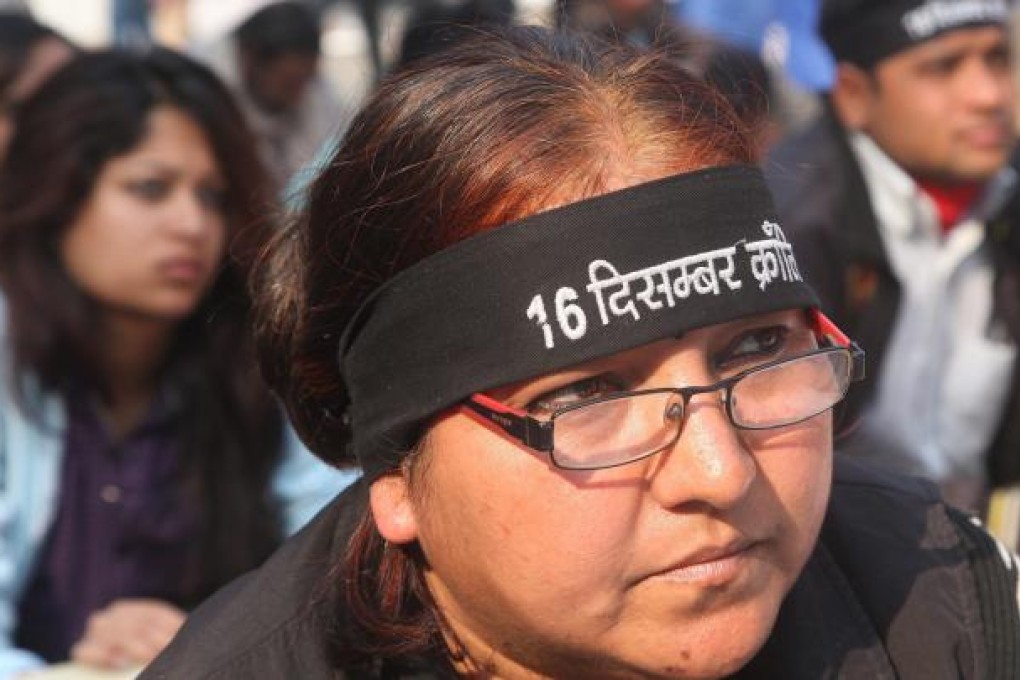 Indian activists wear black head bands in a protest against the gang-rape of a student in New Delhi. Photo: EPA