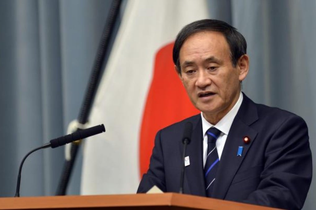 Japanese Chief Cabinet Secretary Yoshihide Suga speaks during a news conference at the prime minister's official residence in Tokyo. Photo: EPA