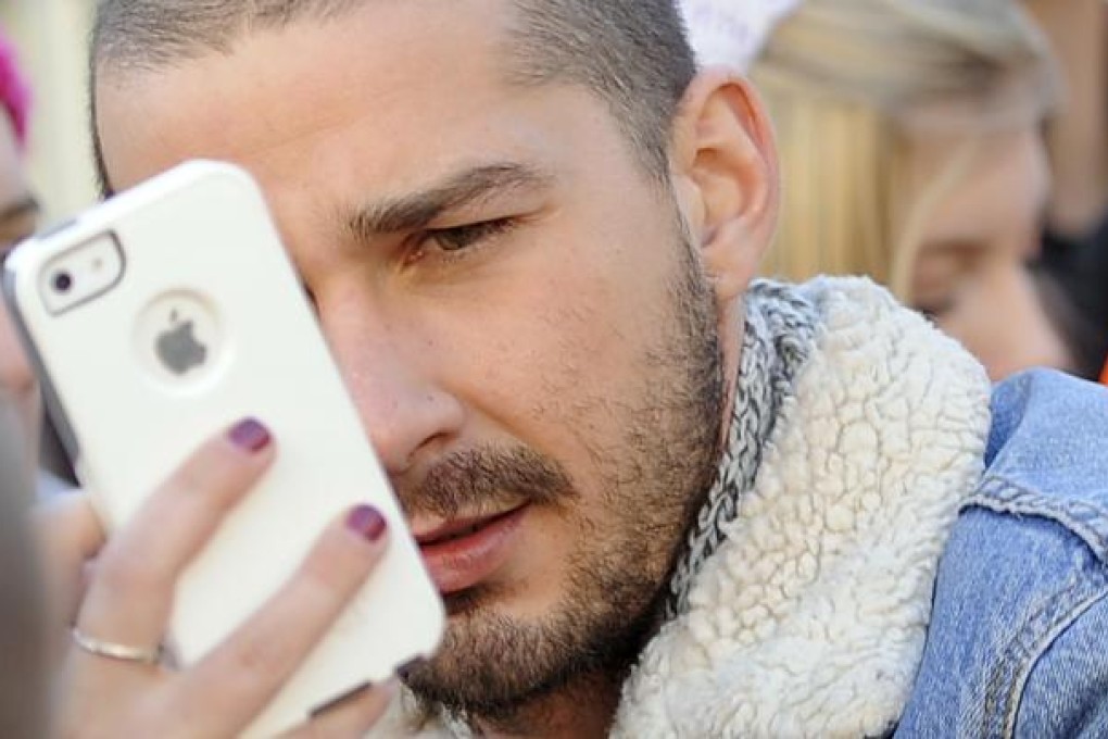 The US actor, Shia LaBeouf, poses for an iPhone photo at the Sundance Film Festival. A new survey has reported that Apple’s iPhone was the most popular smartphone among US buyers late last year but Android handsets were on top worldwide. Photo: AP