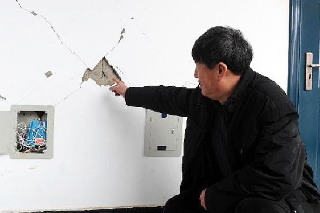 Cracks appear on the wall of a government building in Liutiaozhai township, Dengta, Liaoning province. Photo: Xinhua