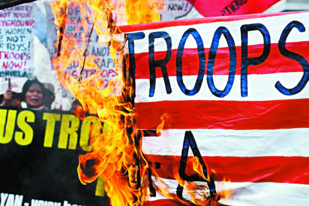 Activists in Manila protest against United States military presence in the Philippines in May last year. Photos: AFP; Corbis; Guardian News & Media; Raissa Robles