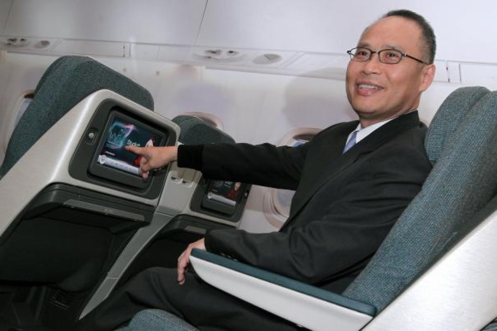 Patrick Yeung shows off Dragonair's new seats. Photo: K.Y. Cheng