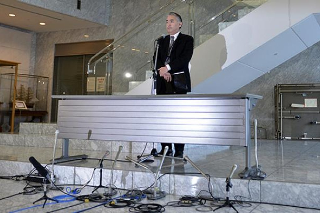 JGC Corporation's spokesman Takeshi Endo attends a press conference at the company's headquarters in Yokohama. Photo: AFP