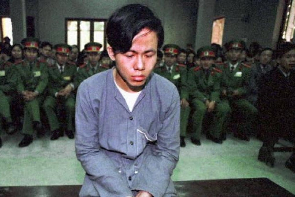 A young Vietnamese hears that he will be executed by firing squad in Hanoi in 1997. Photo: Reuters