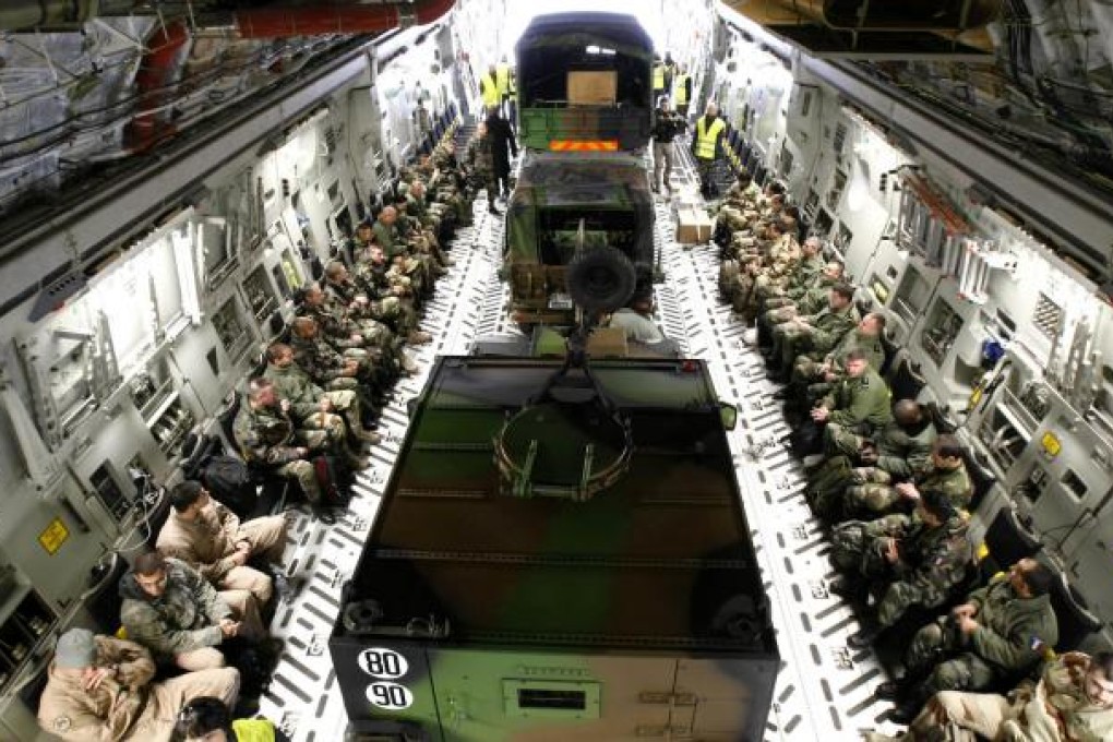French soldiers aboard a US air force transport plane heading for Mali from Istres airbase, near Marseille, southern France. Photo: AP