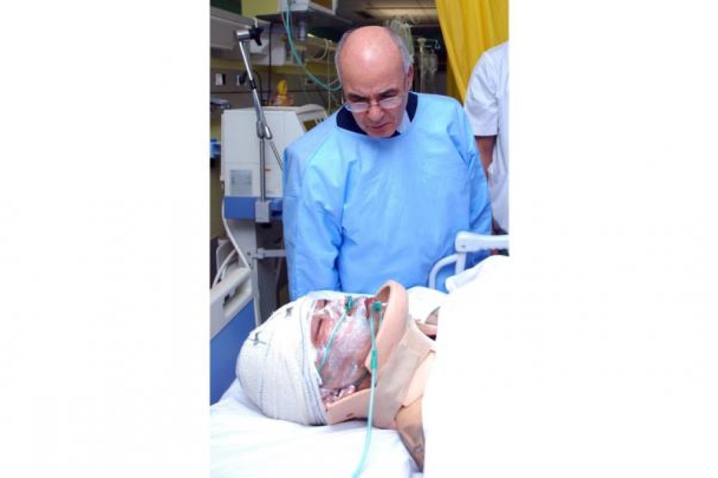 An Algerian minister visits a rescued Philippine hostage. Photo: EPA