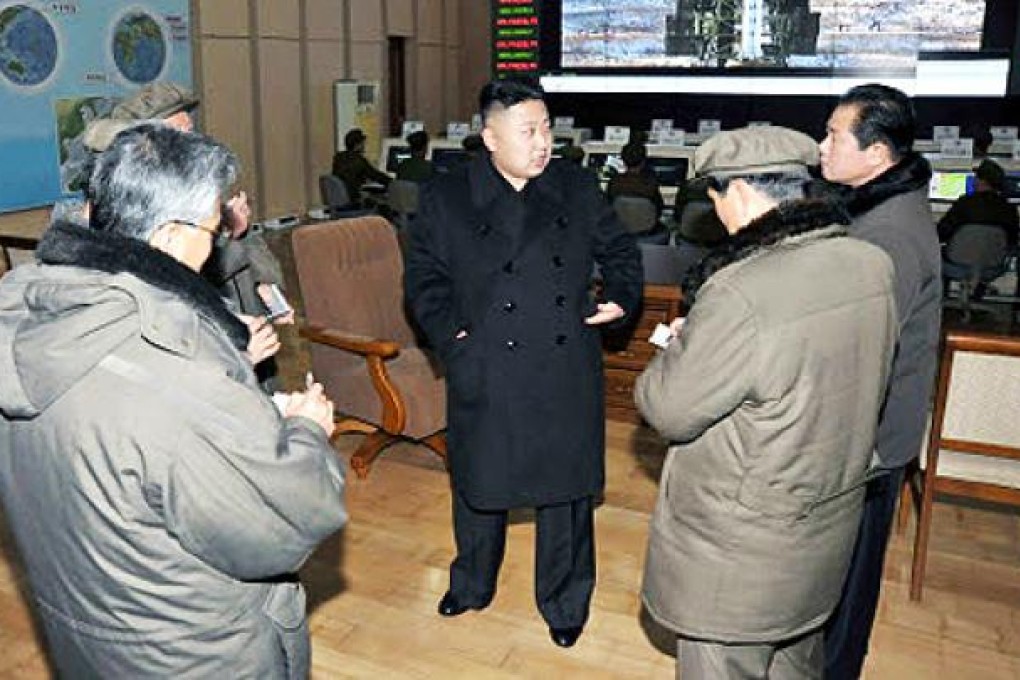 North Korean leader Kim Jong-un (centre) visits a satellite launch site in Cholsan county. North Korea is threatening “physical counter-measures” over tighter UN sanctions following its recent rocket launch. Photo: Reuters