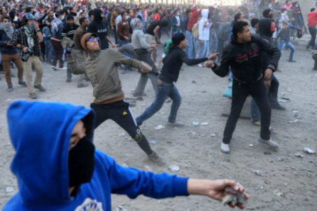 Protesters clash with police near Cairo's Tahrir Square during recent demonstrations held nationwide to mark the second anniversary of the 2011 unrest. Photo: Xinhua