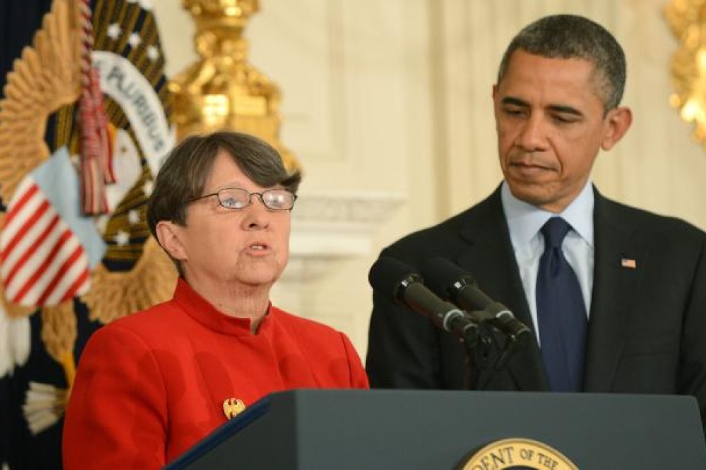 US President Barack Obama (right) listens as Mary Jo White, his nominee to be the next chair of the Securities and Exchange Commission delivers remarks. Photo: EPA
